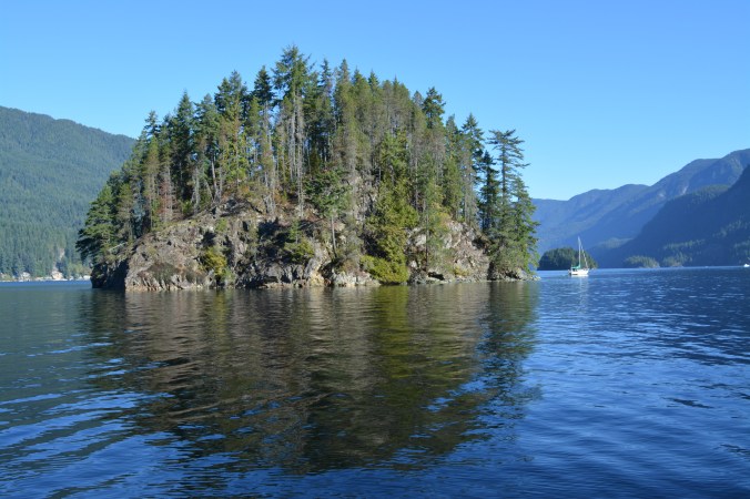 A photo of Jug Island and Indian Arm on a sunny day in Belcarra, BC.