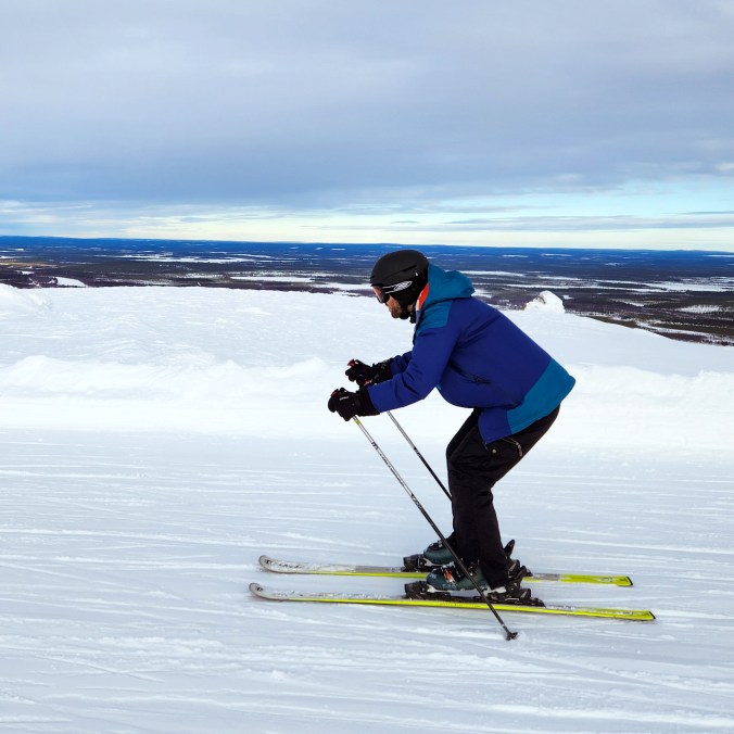 Male skier on a flat run at Levi Ski Resort in Lapland, Finland