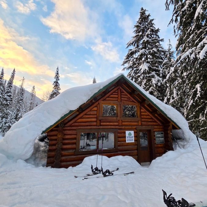 ACC's A.O. Wheeler Hut in Glacier National Park on a sunny day in the winter in BC.